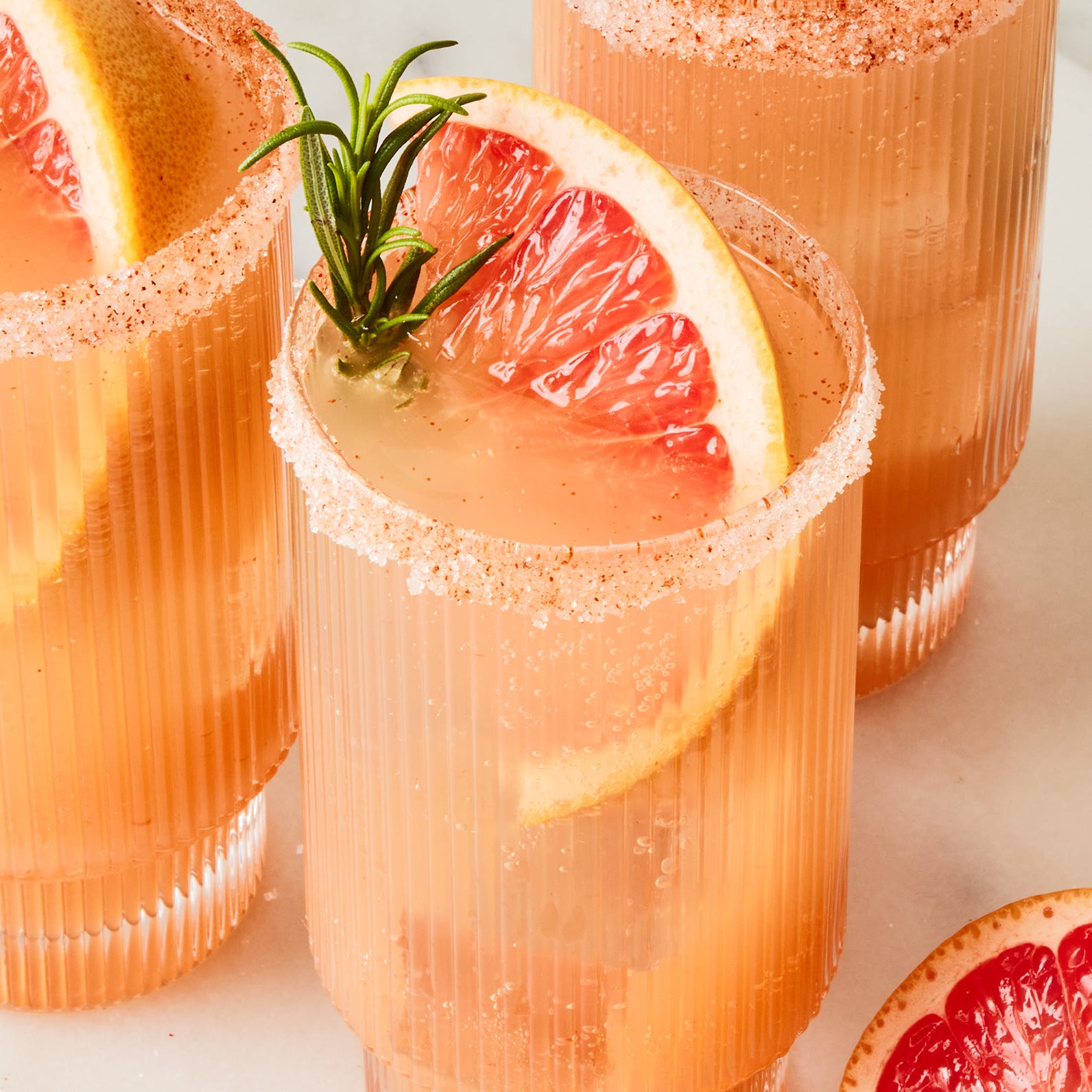 grapefruit rosemary mocktail spritz topped with grapefruit slices and rosemary sprigs