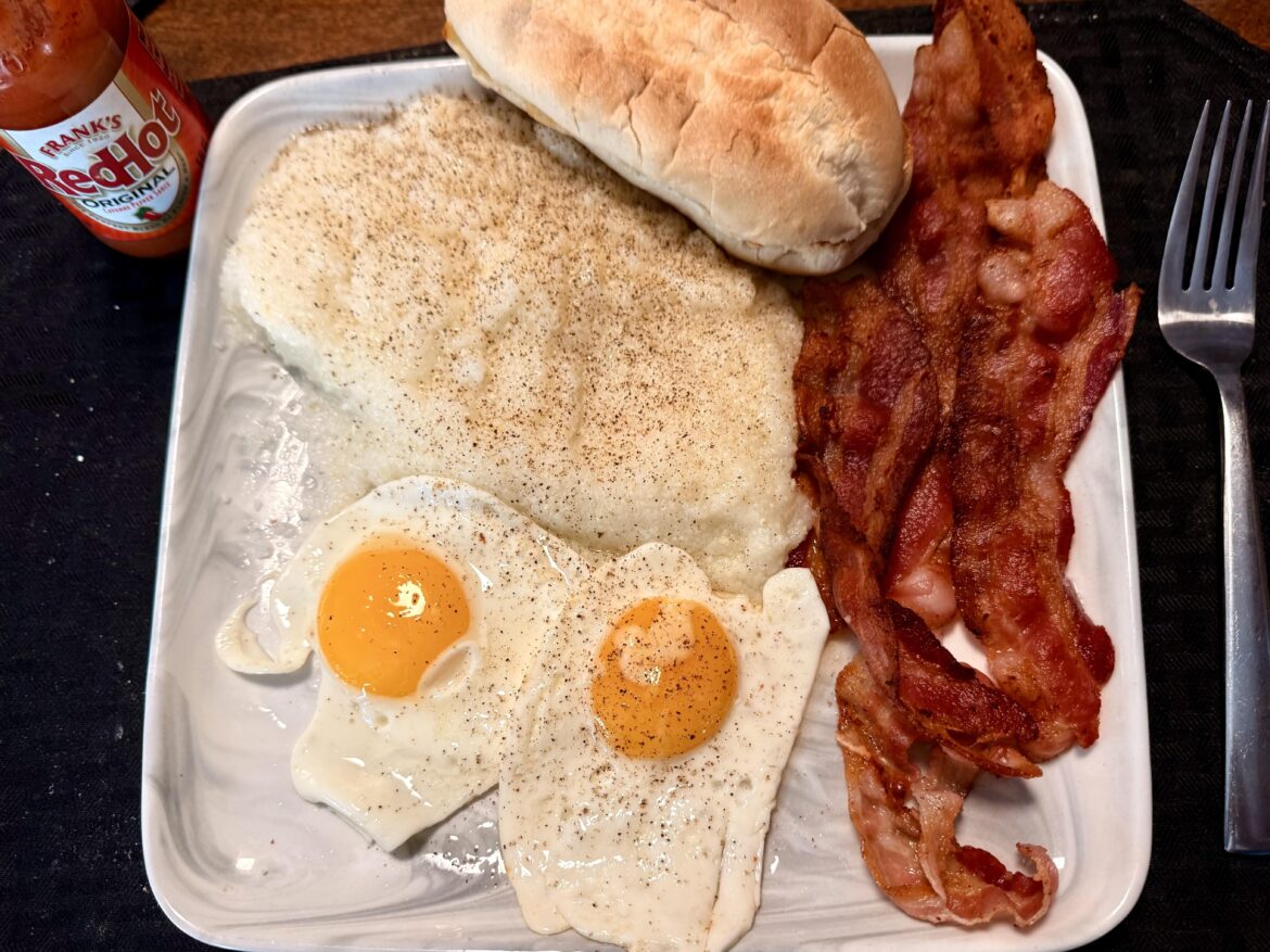 Bacon, eggs, grits, and a toasted roll