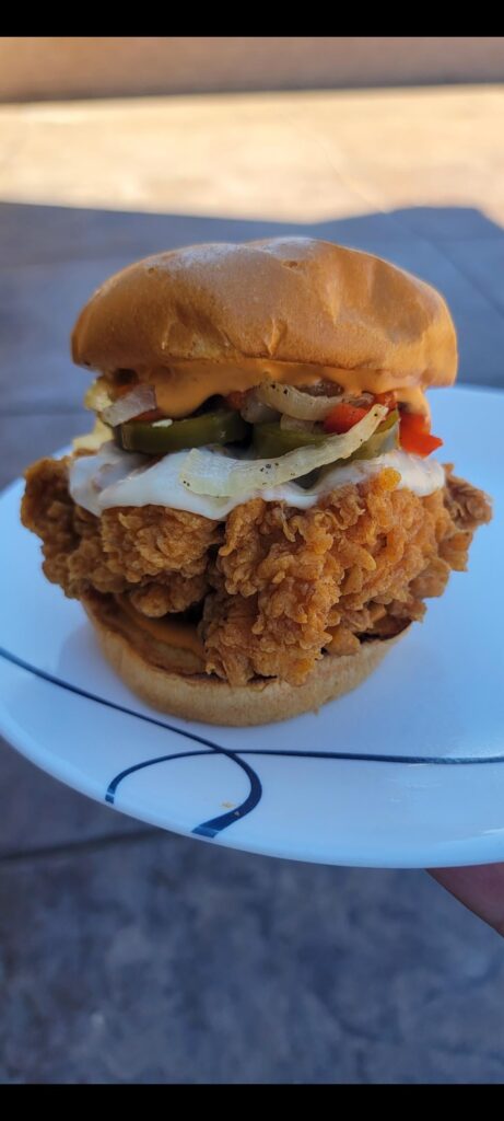 Im not sure what to call this, any suggestions? It has pickled jalapeños, roasted red peppers and onions, chipotle aioli, provolone cheese.