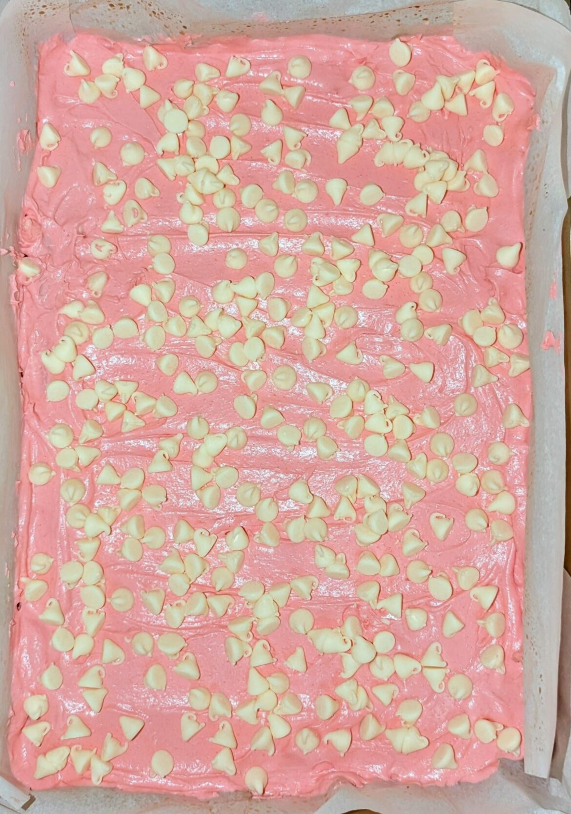 Strawberry brownies with strawberry frosting and white chocolate chips