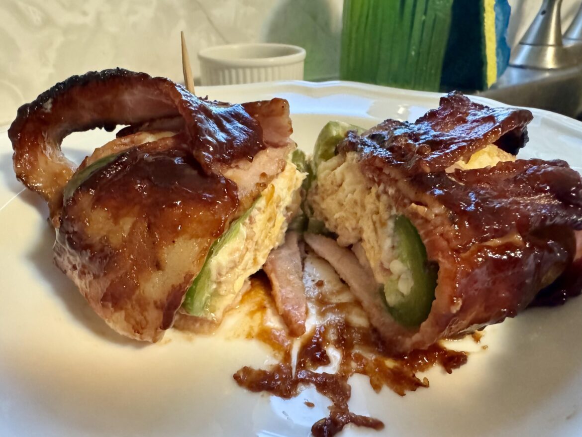 Bacon wrapped cream cheese and cheddar stuffed jakapeños bathed in Barbill barbecue sauce