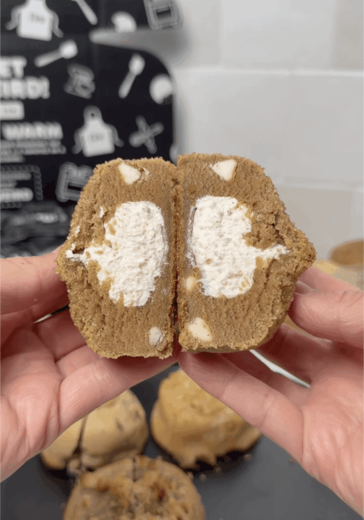 Pumpkin spice cookies with cheesecake frosting core.