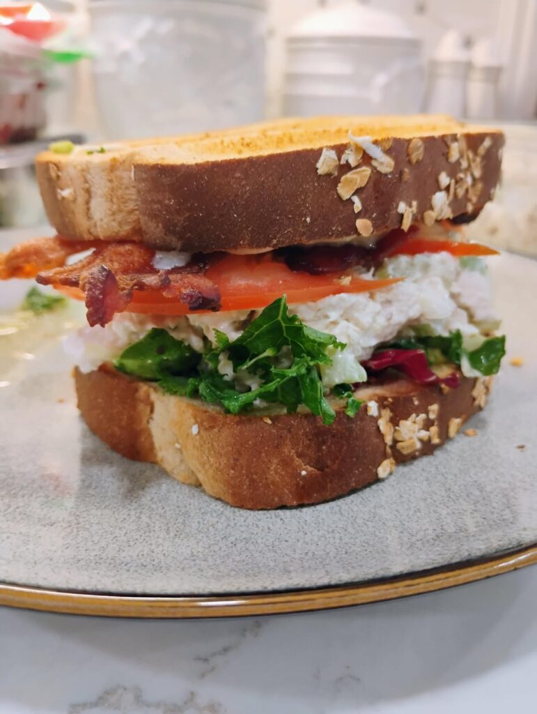 Chicken salad BBLT on toasted whole grain wheat Chicken salad BBLT on toasted whole grain wheat