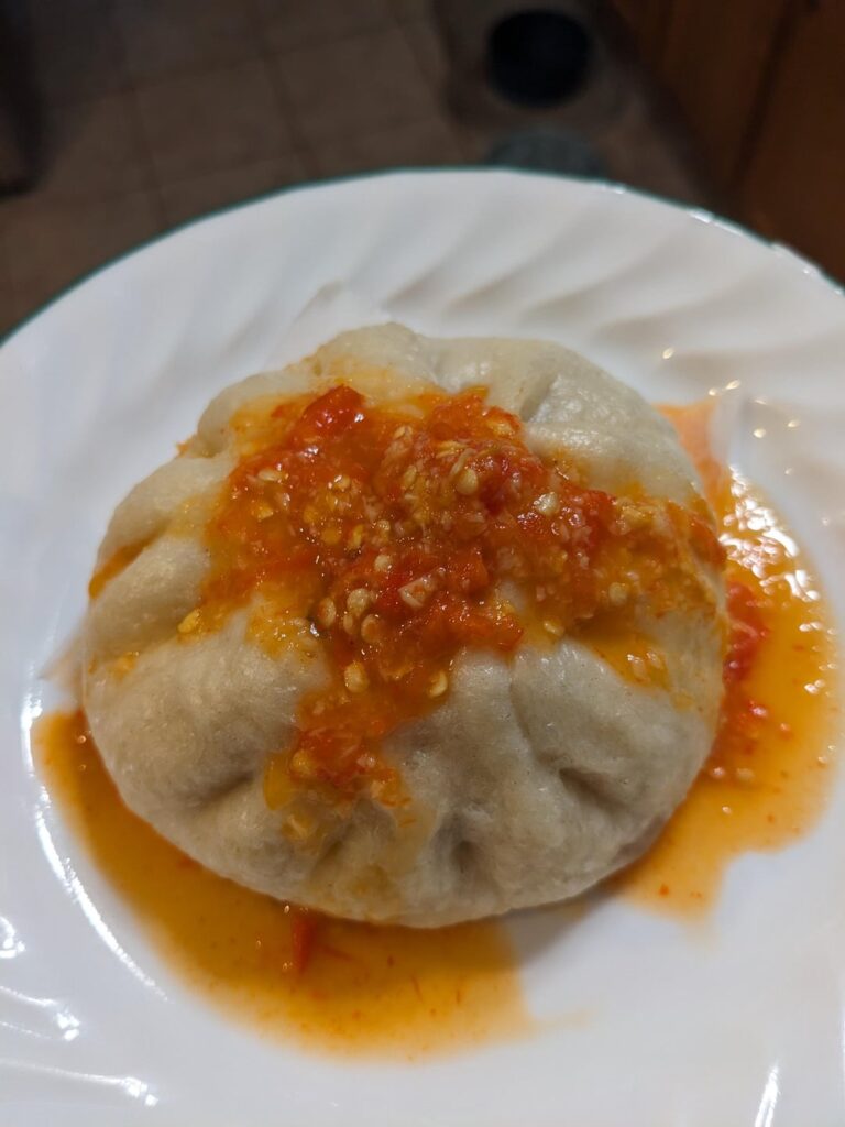 Homemade Chicken bao drenched in homemade Thai chili garlic sauce