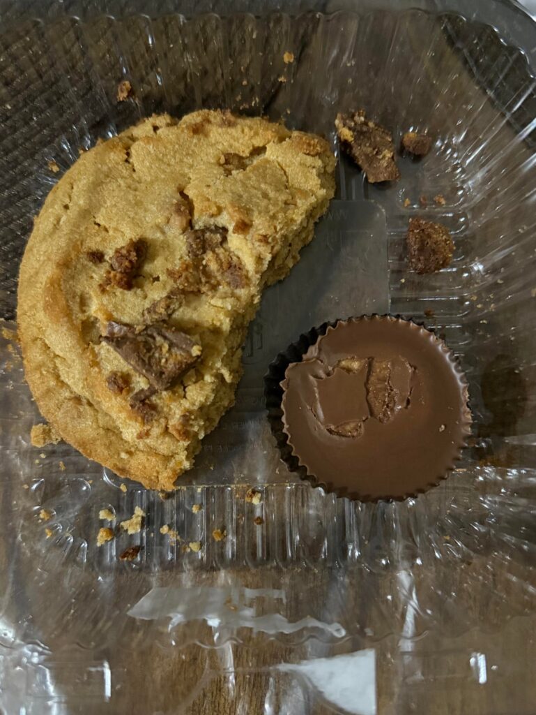 how many calories do you think this half of a cookie is? It’s thick and reeses flavored (Reese’s cup for size comparison)