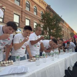 The annual cannoli eating contest underway in Bensonhurst. Photo courtesy of Jay Zhang