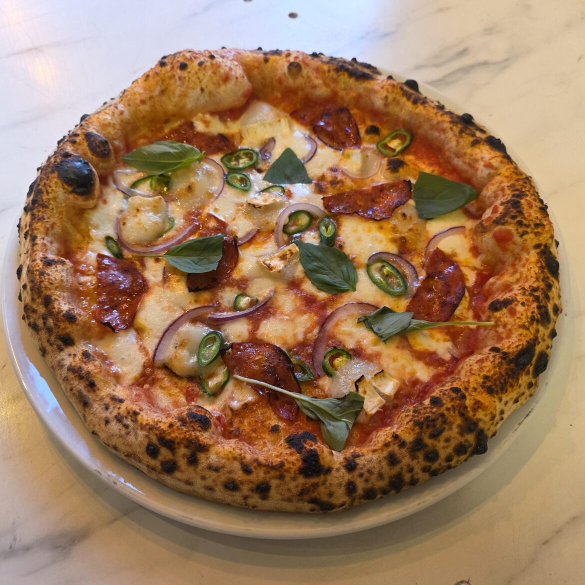 Goats cheese, chorizo, chillies and red onion