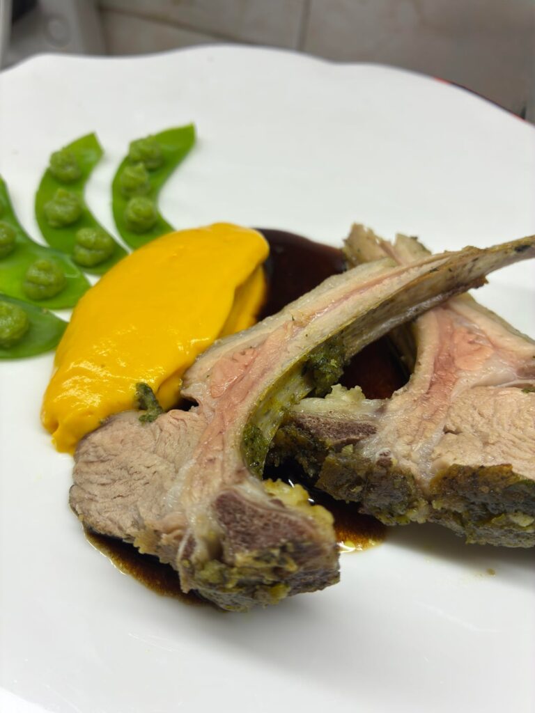 Lamb rack, carrot purée, beef au jus, green pea purée