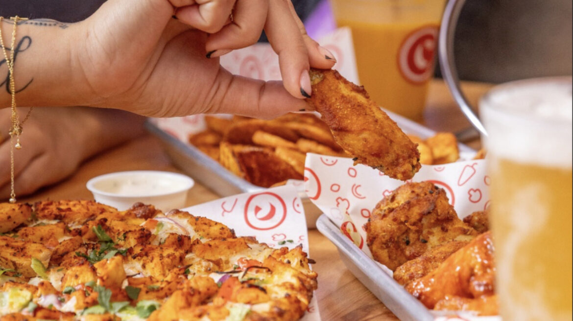 The Lesser-Known Pizza Chain Known For Its Indian Fusion Pies