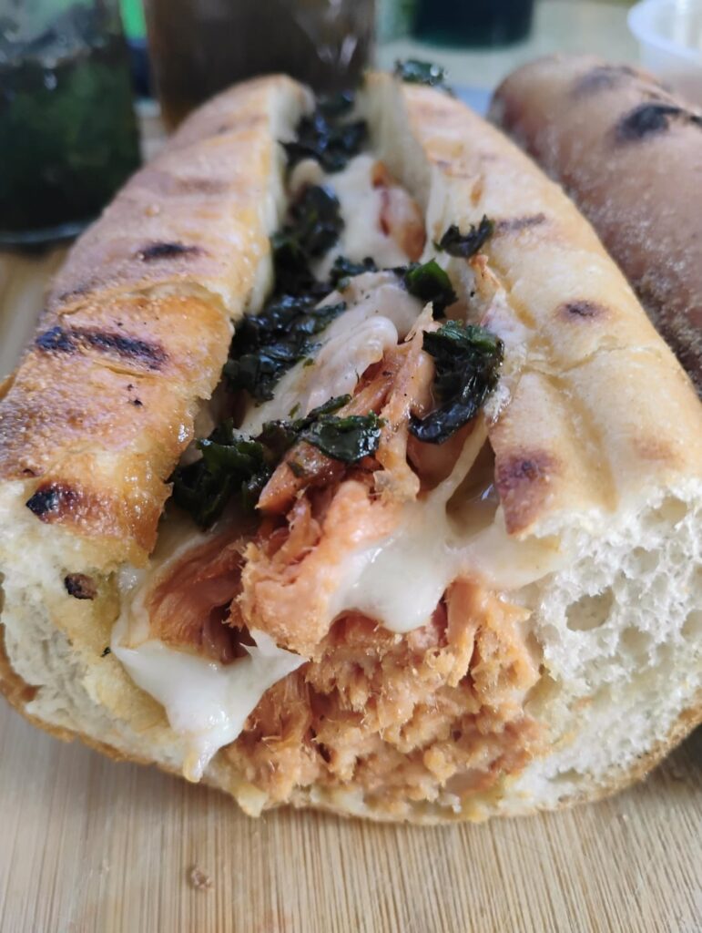 Shredded Italian roast pork with provolone + some basil garlic oil I added on top & hot pepper oil inside