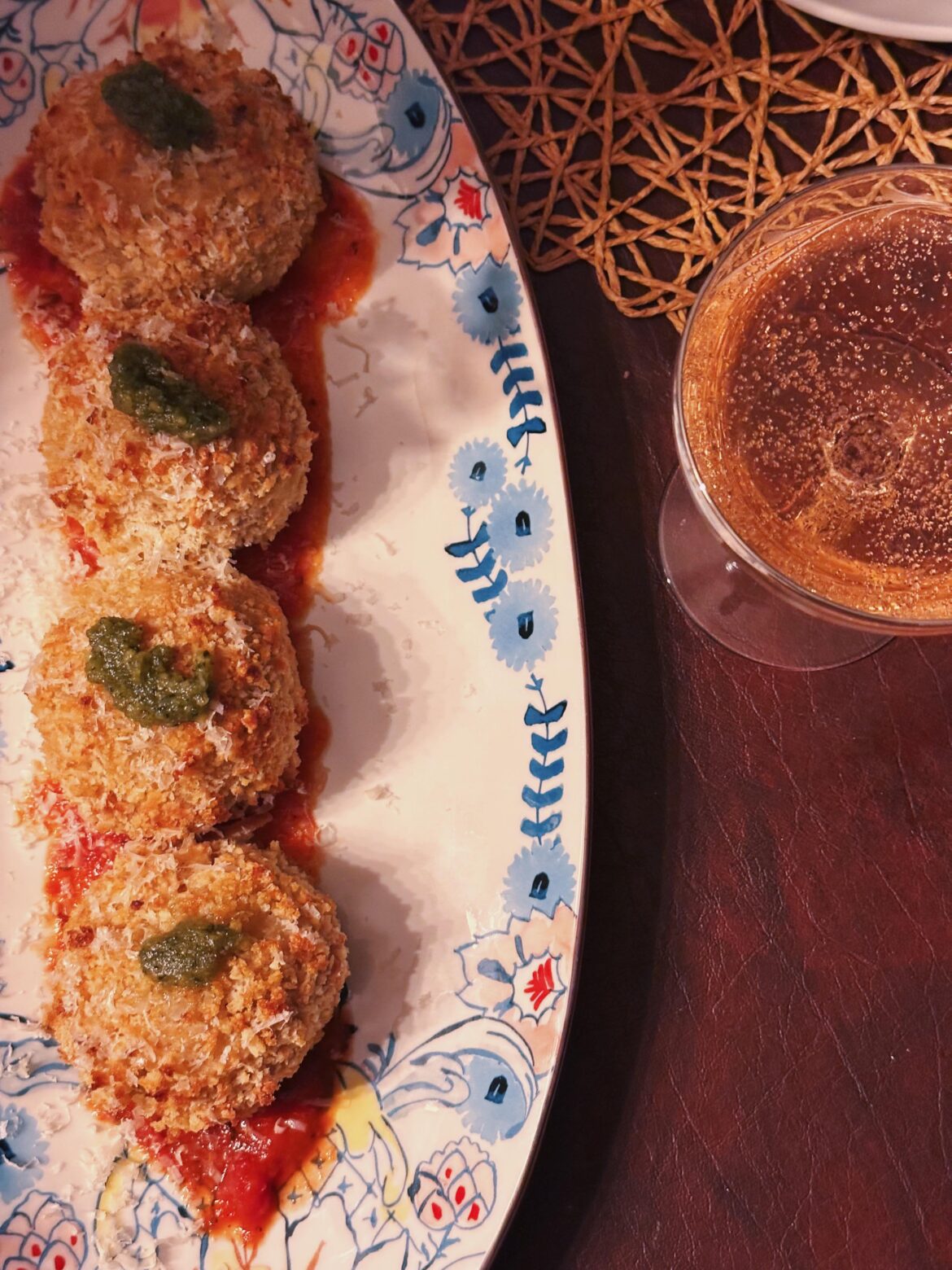 after being in a weird funk over the last few months..i finally felt inspired to cook again. homemade arancini with pesto and mozzarella filling + tomato basil sauce