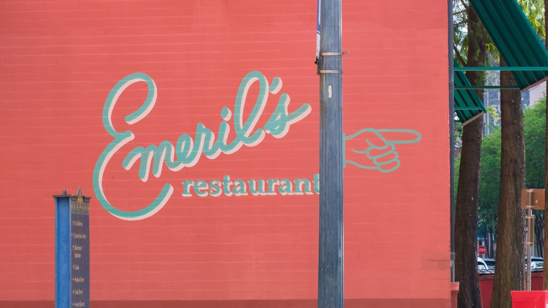 The bright red exterior of Emeril's restaurant in New Orleans.