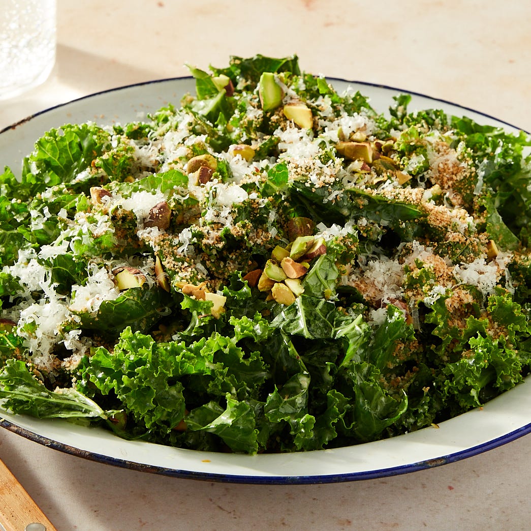 curly kale salad topped with toasted breadcrumbs, pistachios, and pecorino