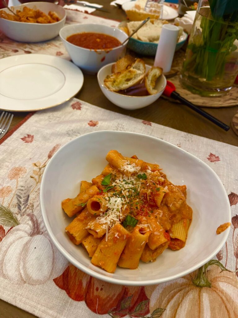 Birthday dinner and dessert for my fiancé 🥰 Syracuse-special chicken riggies, spicy tomato oil, and a mocha-chocolate cake with buttercream frosting.