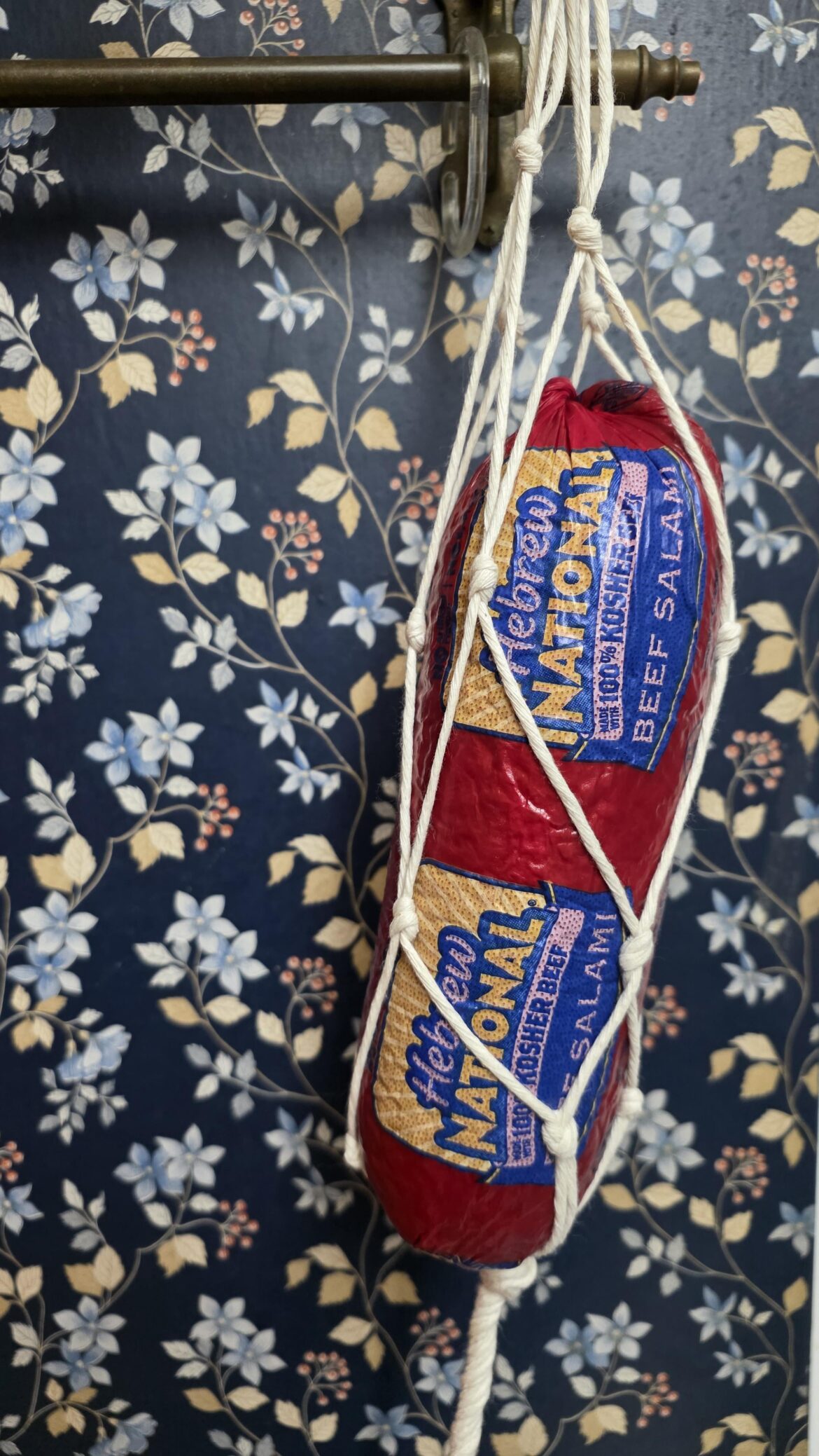 My eccentric BiL gave me this and told me to hang it for 4 months. Packaging says "Keep Refrigerated" and our kitchen stays between 68 and 78 degrees.