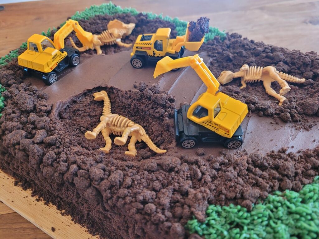 My three year old asked for a construction and dinosaur cake. This is what I came up with!