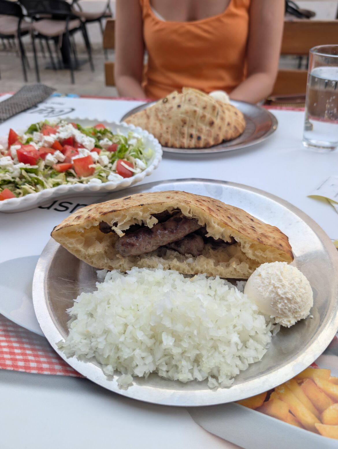 Onions the size of the main itself. Ćevapi in Sarajevo, Bosnia