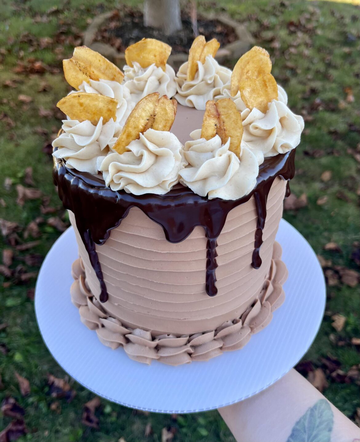 Banana cake with peanut butter buttercream and chocolate outside. My husband is disgusted 🤣 Someone else has to agree this combo works!