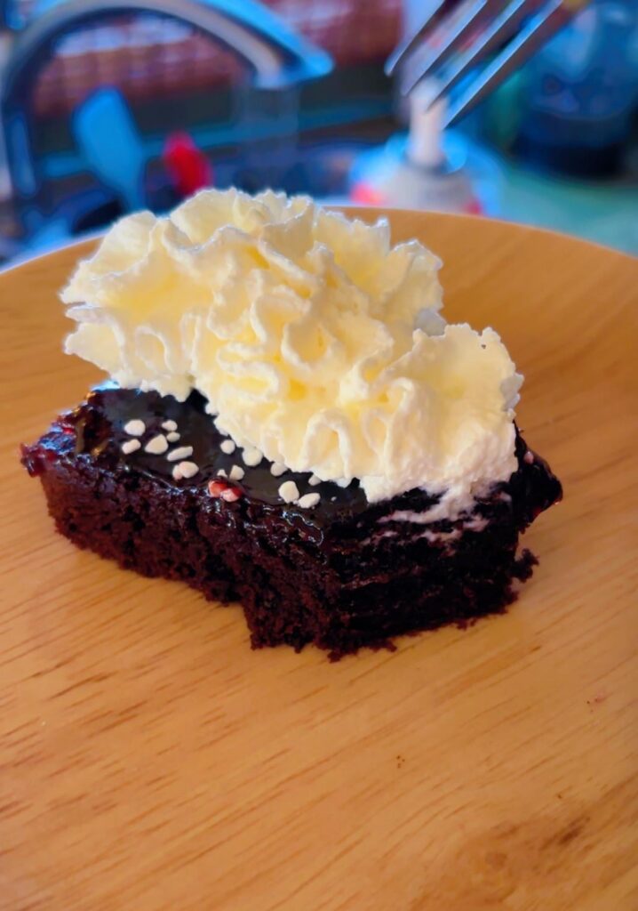 Calling this “Black forest torte” — choc torte topped with cherry compote, swedish pearl sugar, & whipped cream.