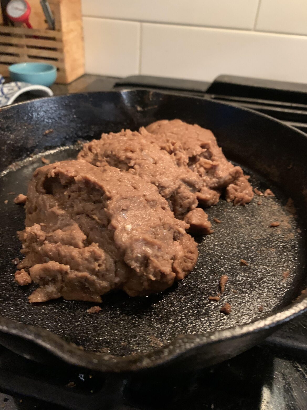 Refried beans with bacon on. Chinitos cast iron.