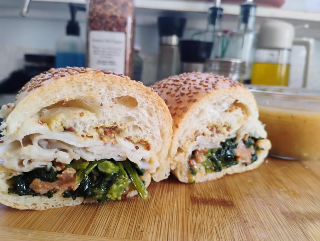 Roasted turkey, melted provolone & slow cooked garlic broccoli rabe w/ spicy Italian sausage on a toasted sesame roll.