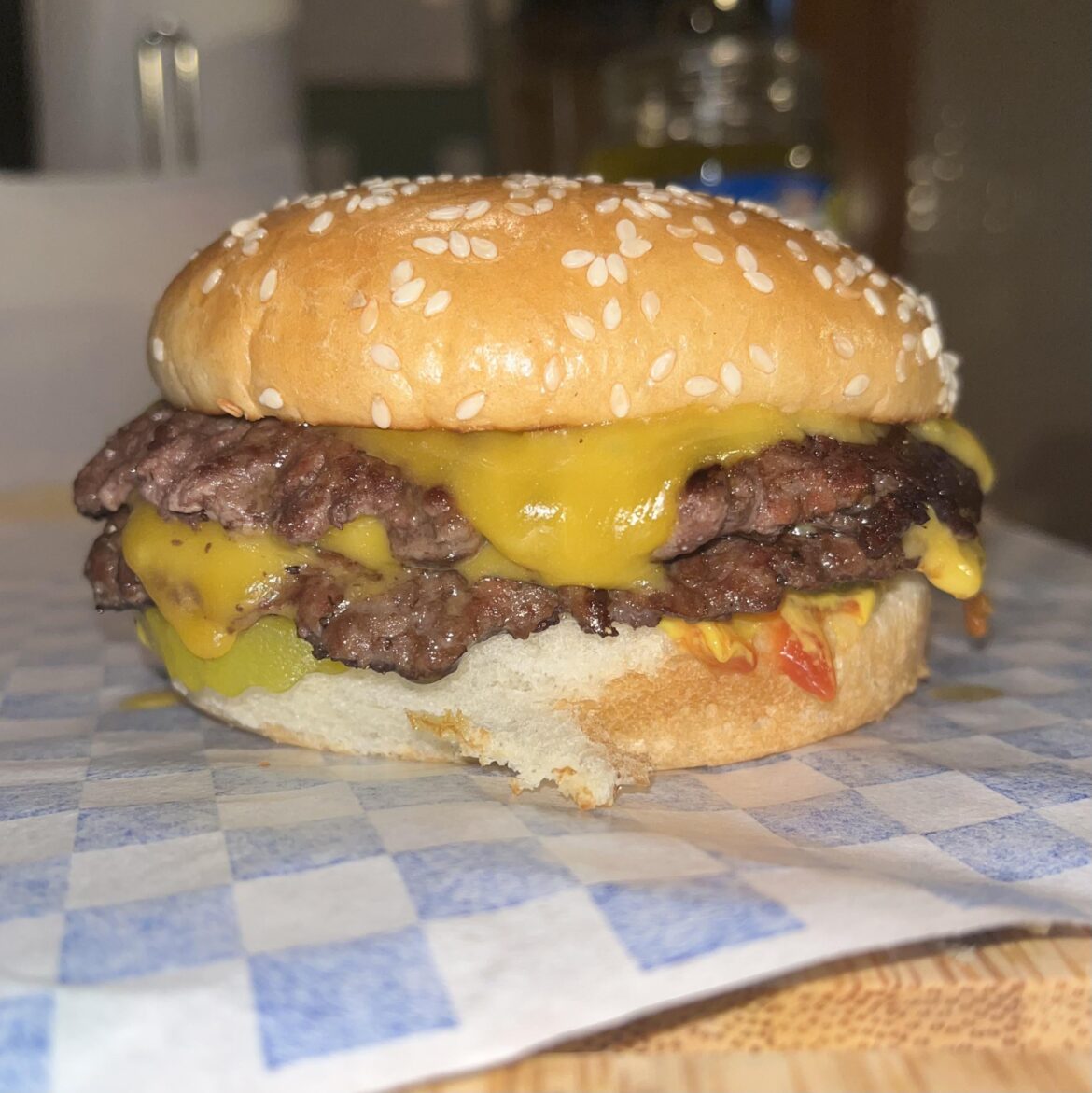 Used cheddar cheese today. Catsup, mustard, pickles on bottom bun.