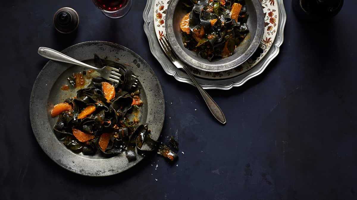 Squid ink tagliatelle with mandarin and capers 