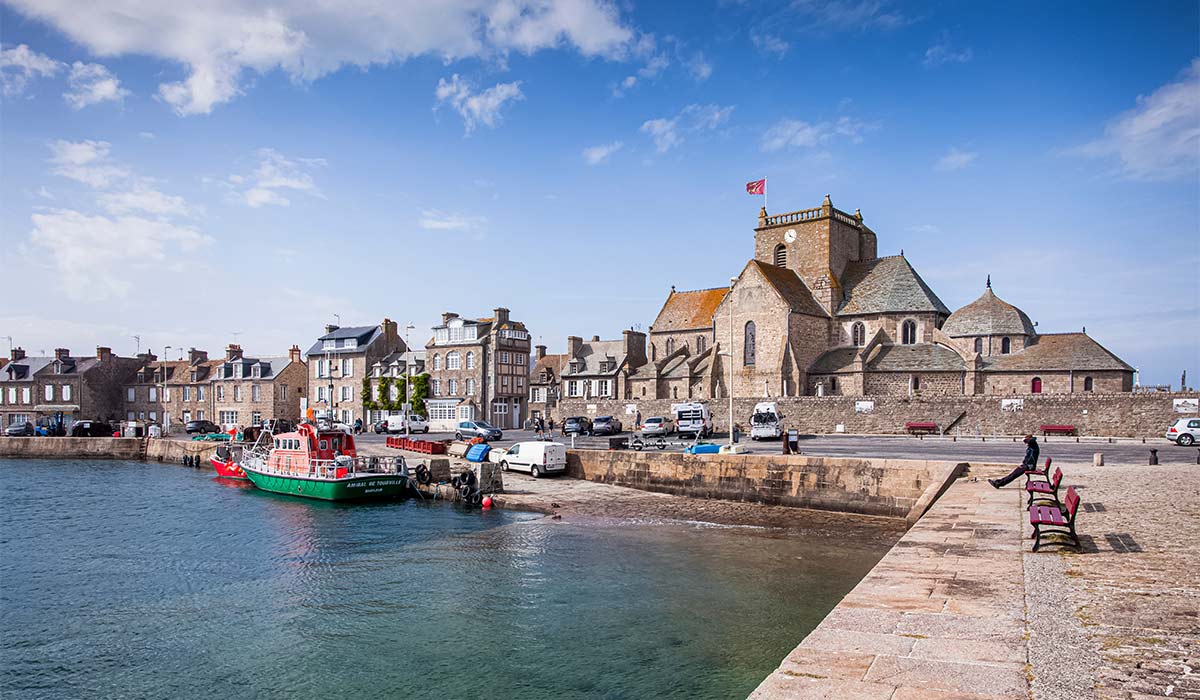 BARFLEUR, NORMANDY, FRANCE - View on Église Saint-Nicolas from the Quay Henri Chardon. Pic: Shutterstock