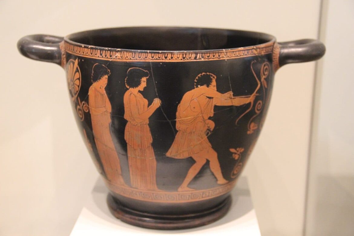 An ancient Greek skyphos wine cup, deocrated in the red fiugre style, dated c. 440 BC.