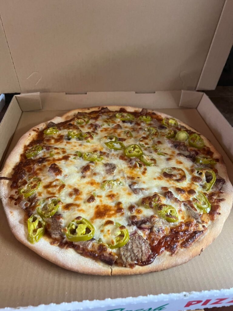 Home made BBQ Brisket Pizza and Jalapeño Popper Pizza.