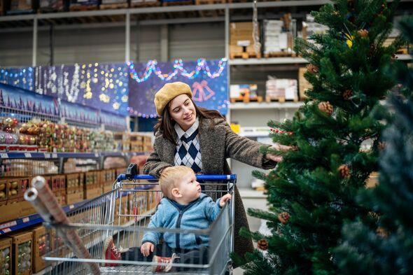 Young mom and her son shopping for Christmas