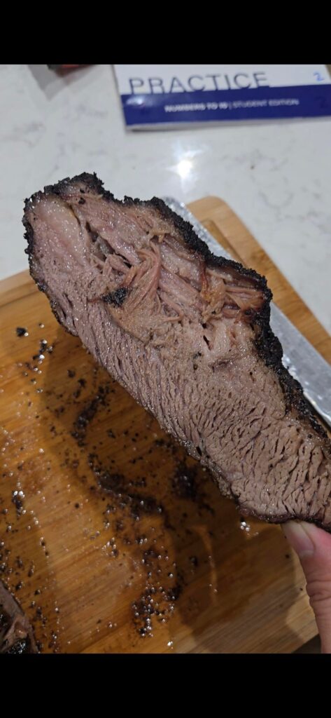 Walmart prime brisket on propane grill with smoke tubes.