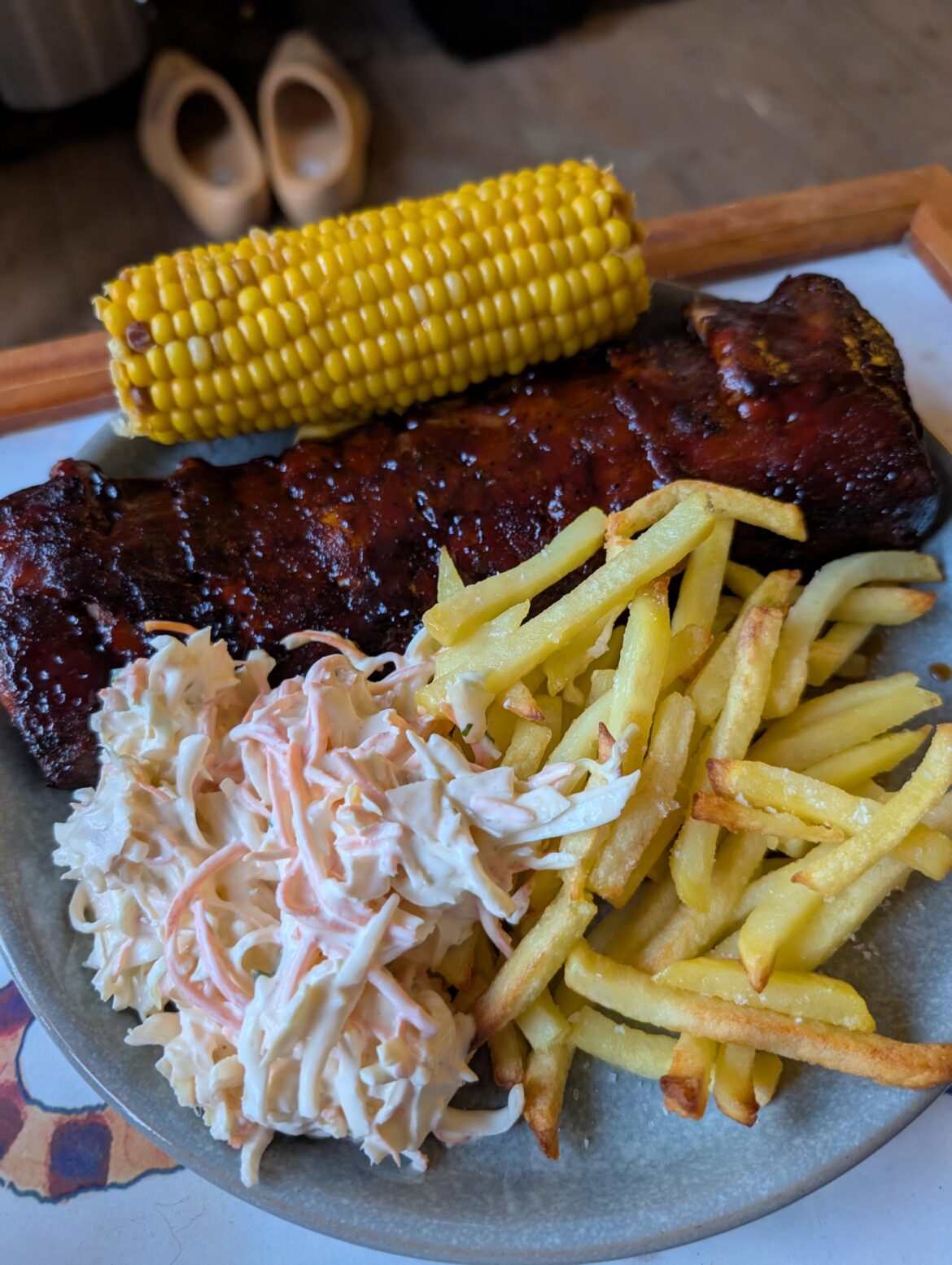 My BBQ Ribs, corn on the cob (butter underneath), fries and coleslaw. My idea of a dirty, sticky feel better dinner!