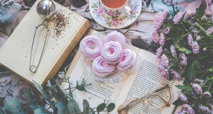 3 of My Favorite Backlist Books About Food tea, pastries, books, flowers, and glasses
