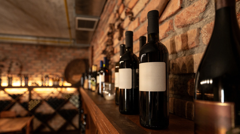 Rustic wine cellar with several bottles of wine