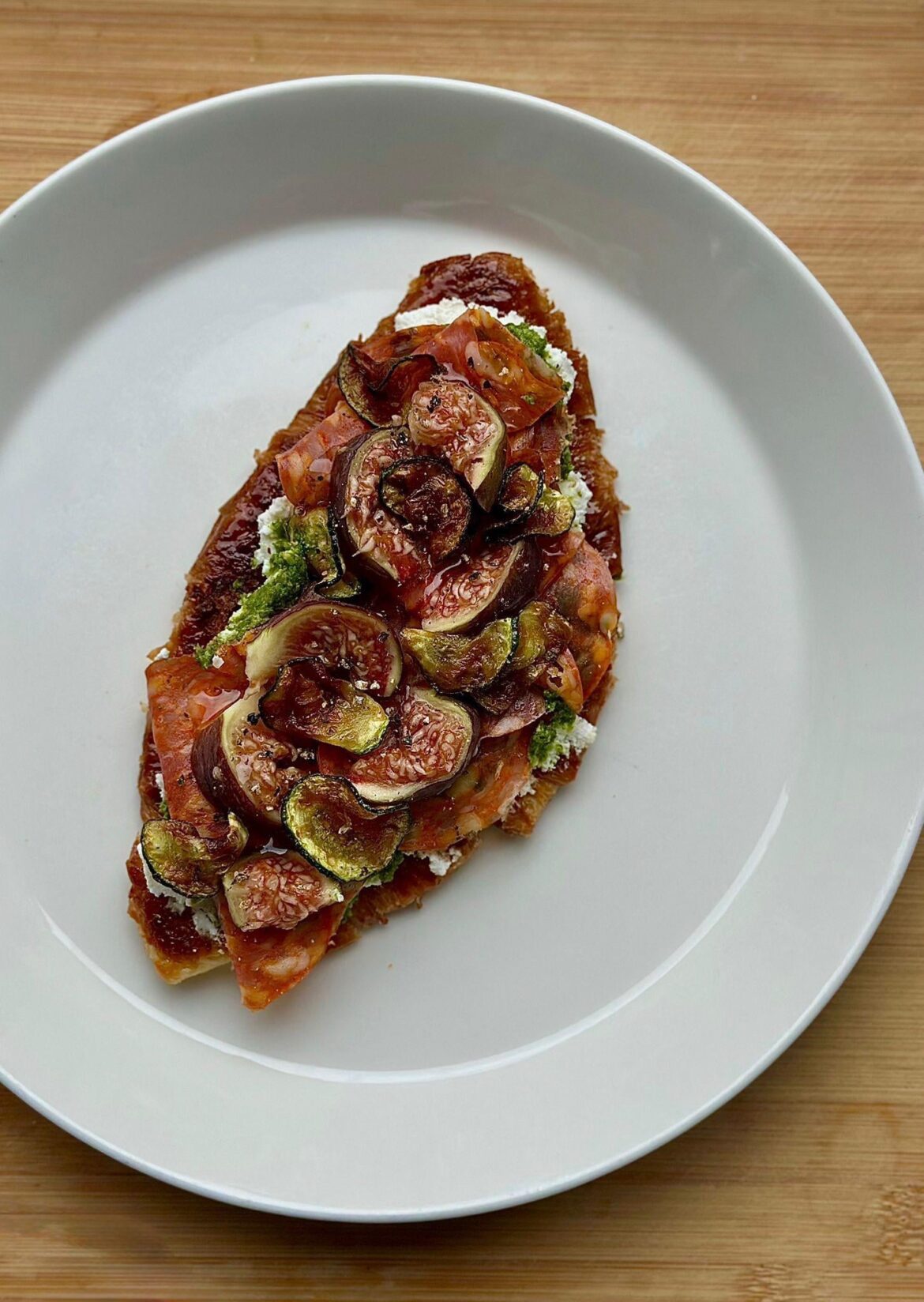 Smashed Croissant with Ricotta, homemade Arugula Pesto, spicy Salami, Figs and fried Zucchini