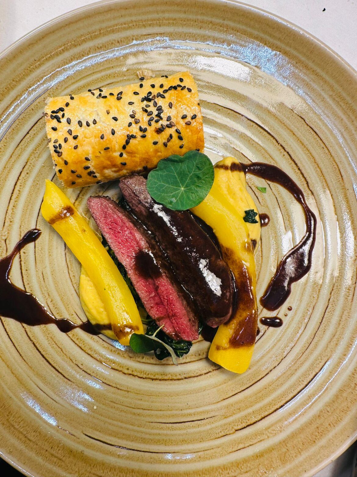 Venison with pumpkin and black pudding sausage roll
