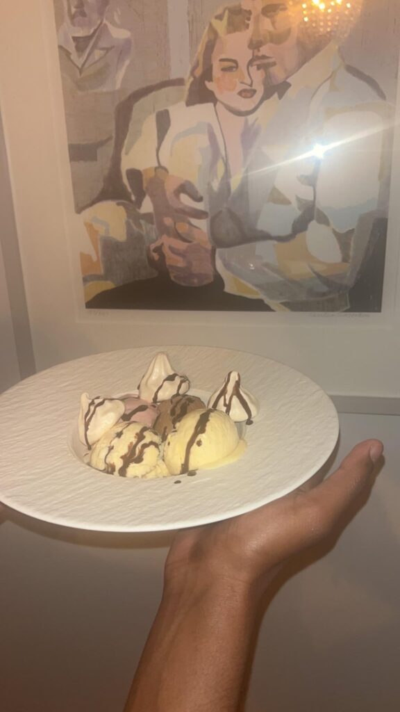Homemade 70% guanaja valrhona Chocolate,Vanilla, Lemon and raspberry gelato with honeyinfused darkchocolate sauce and homemade meringues