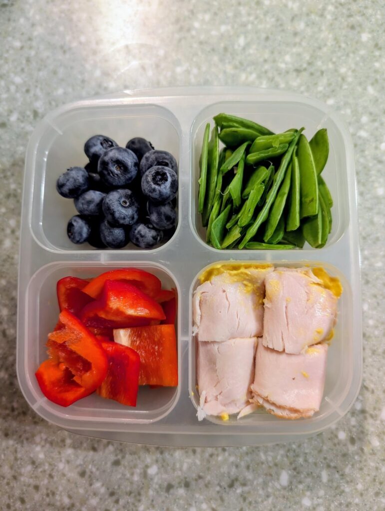 My daily snack box - 2 veg, 1 fruit, 1 protein. More than half a pound of food and 22g of protein for less than 170 calores.