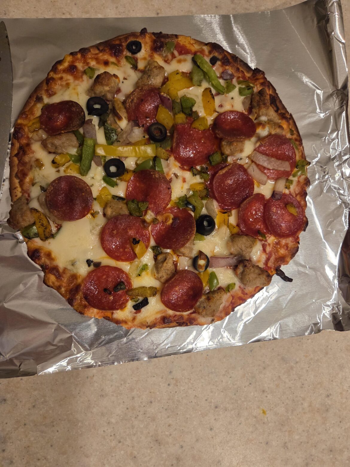 Frozen pizza, screaming Sicilian supreme. Octoberfest and Devil's Backbone pumpkin spice