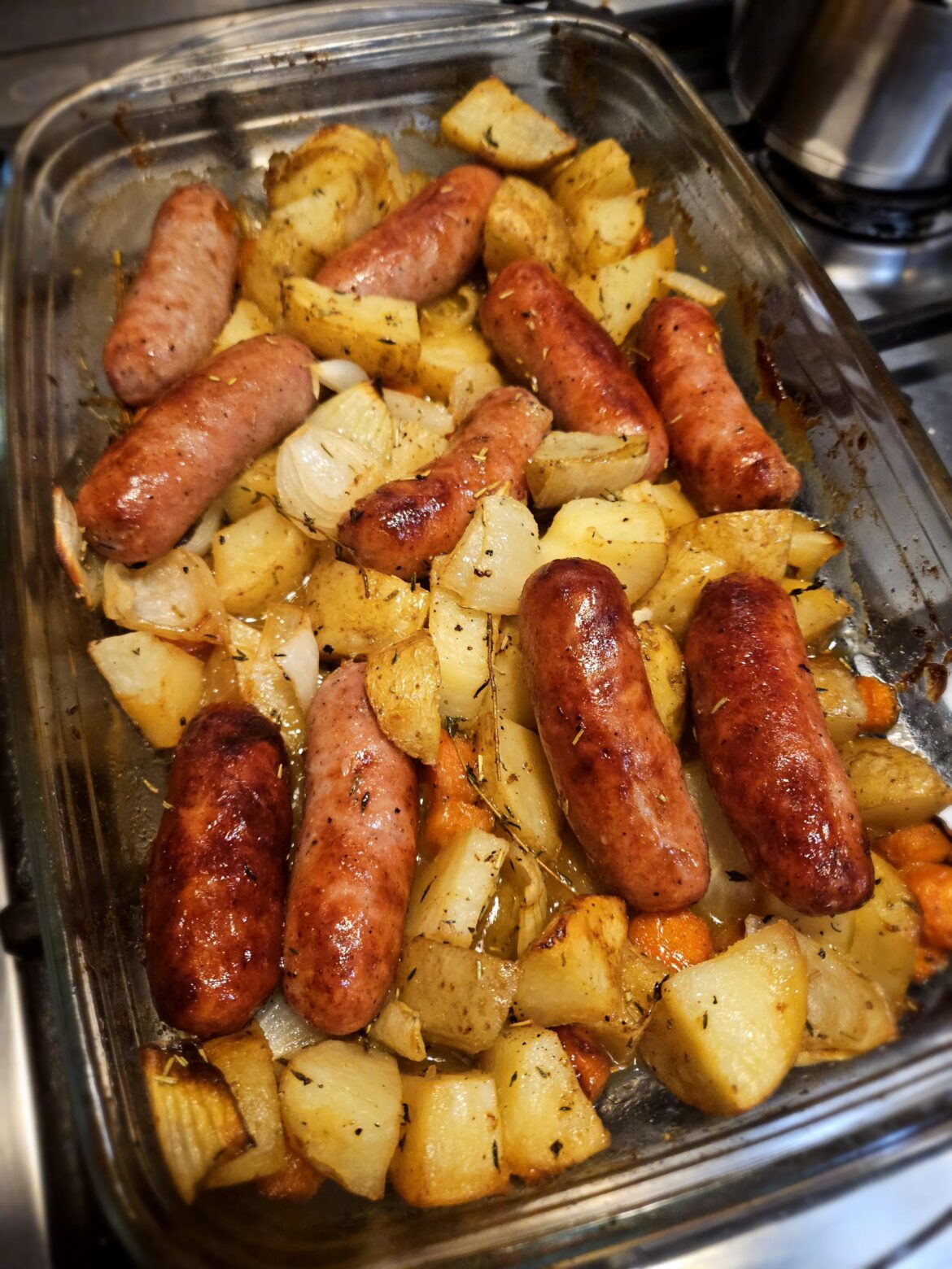 Honey mustard sausage traybake, served with cabbage and gravy.