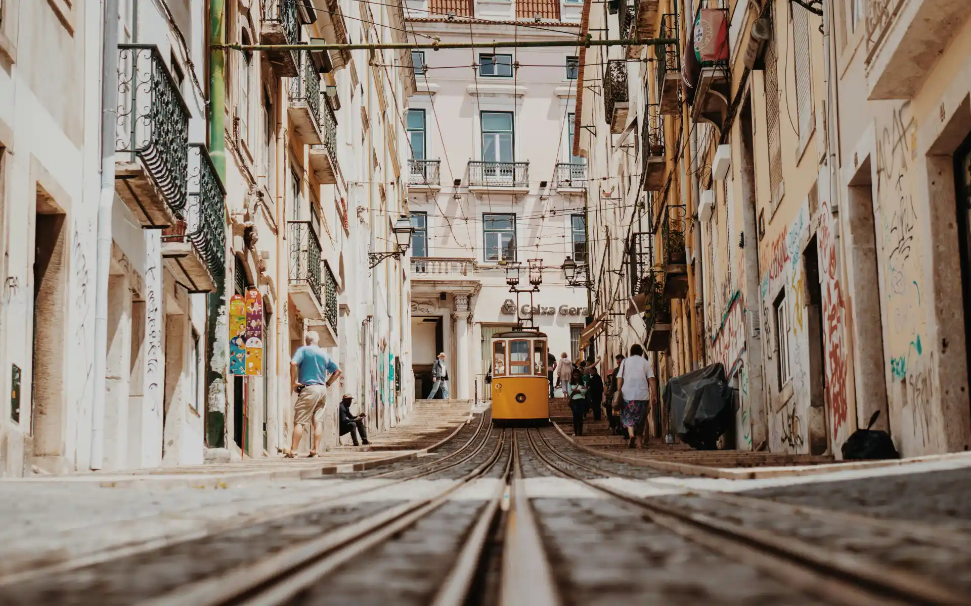 A tram drives down the hill in Lisbon, Portugal