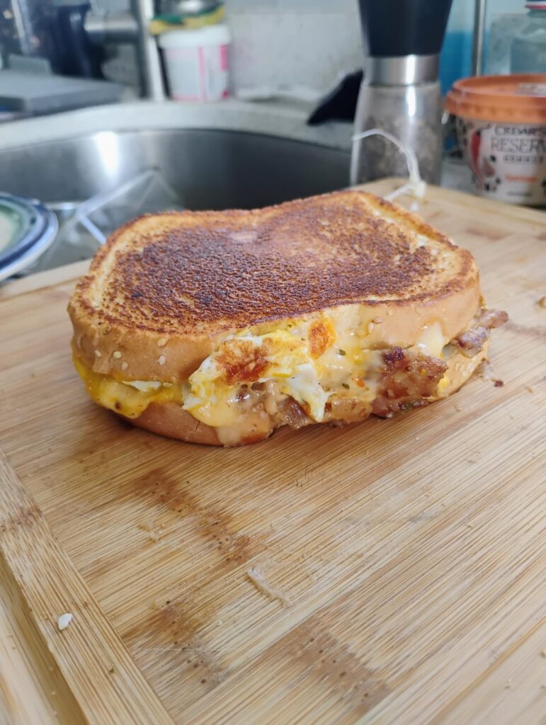Eggs, Gouda & leftover German potato salad (crisped up in a pan) breakfast sandwich.