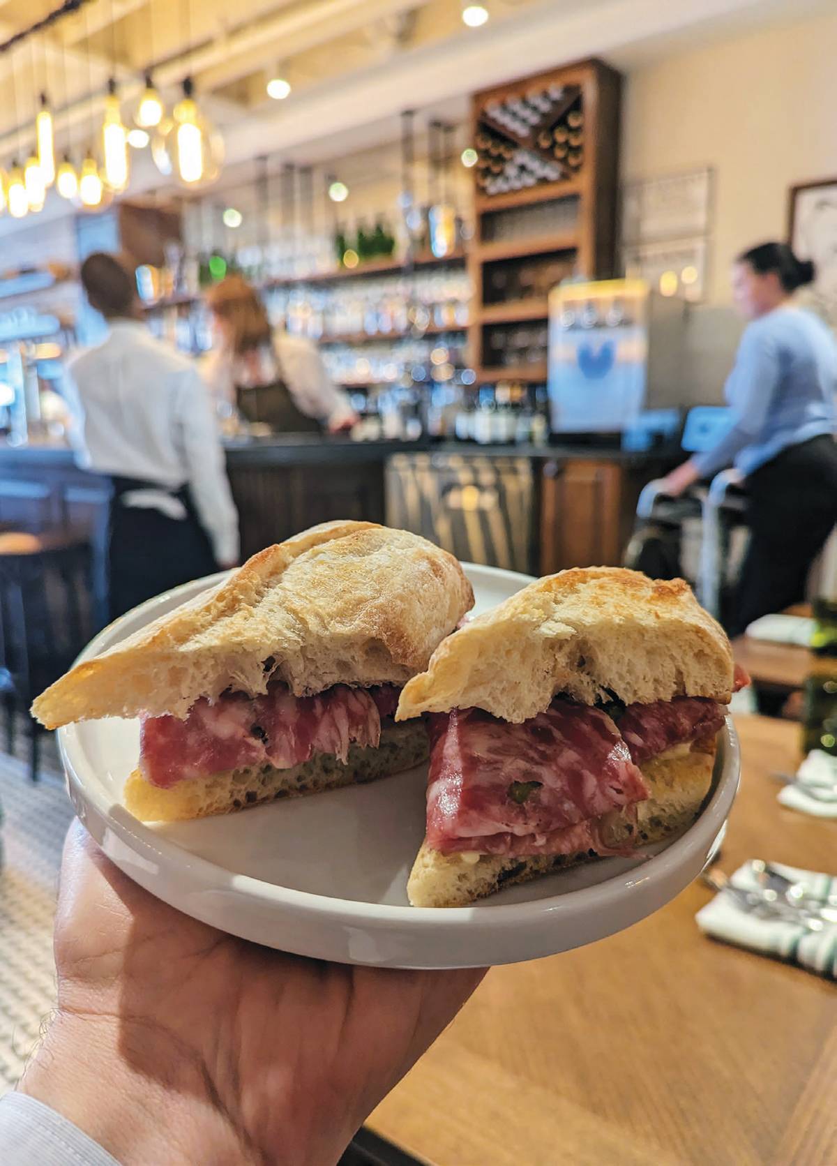 A simple sandwich consisting of Rosette de Lyon (a cured French salami), Echiré butter, and cornichons on baguette, is sublime
