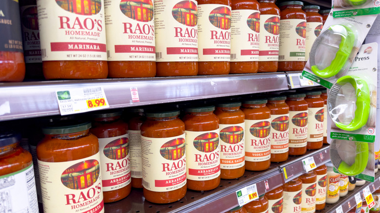Shelves of jarred marinara sauce at a grocery store.