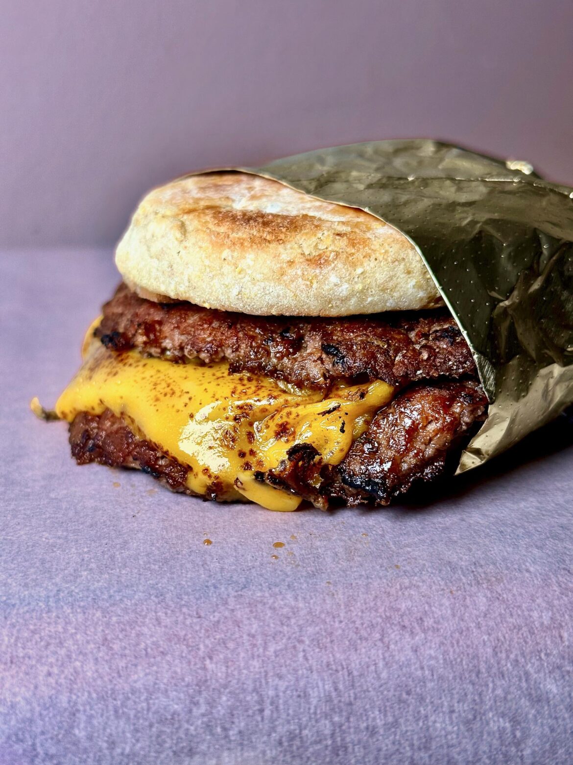 Mini double smash—2oz patties, American cheese, Kewpie, Dijon, English muffin.