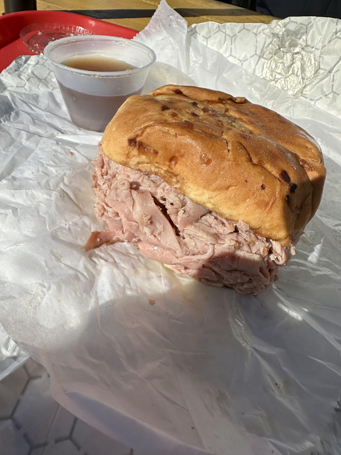 [i ate] 8oz roast beef au jus dipping sandwich on a fresh onion roll.