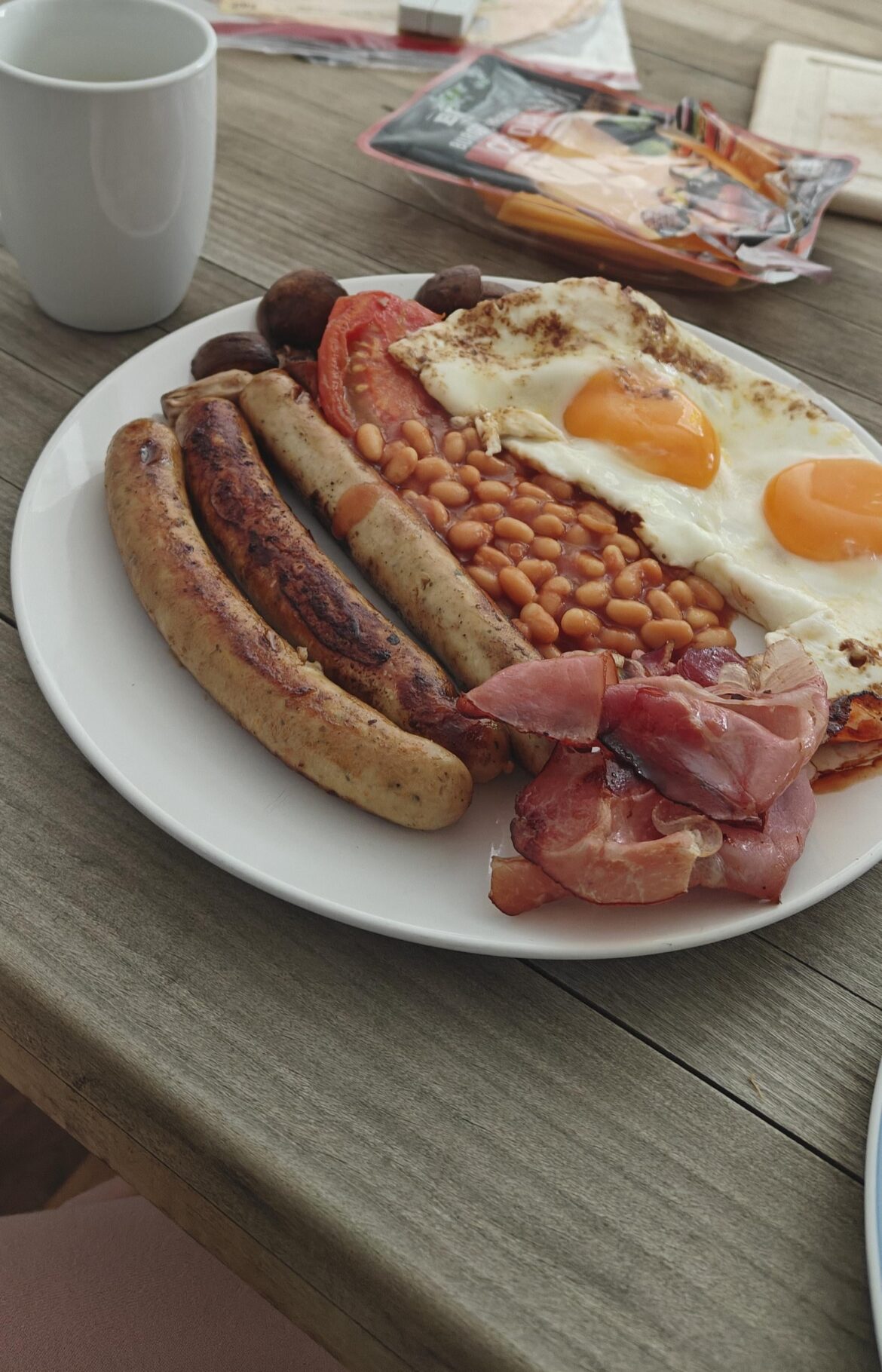 Homemade English breakfast with beans, eggs and sausage