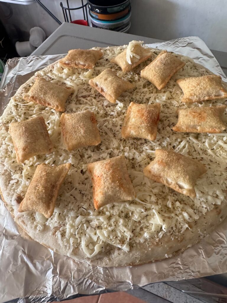 Frozen cheese pizza with spicy pepperoni pizza rolls