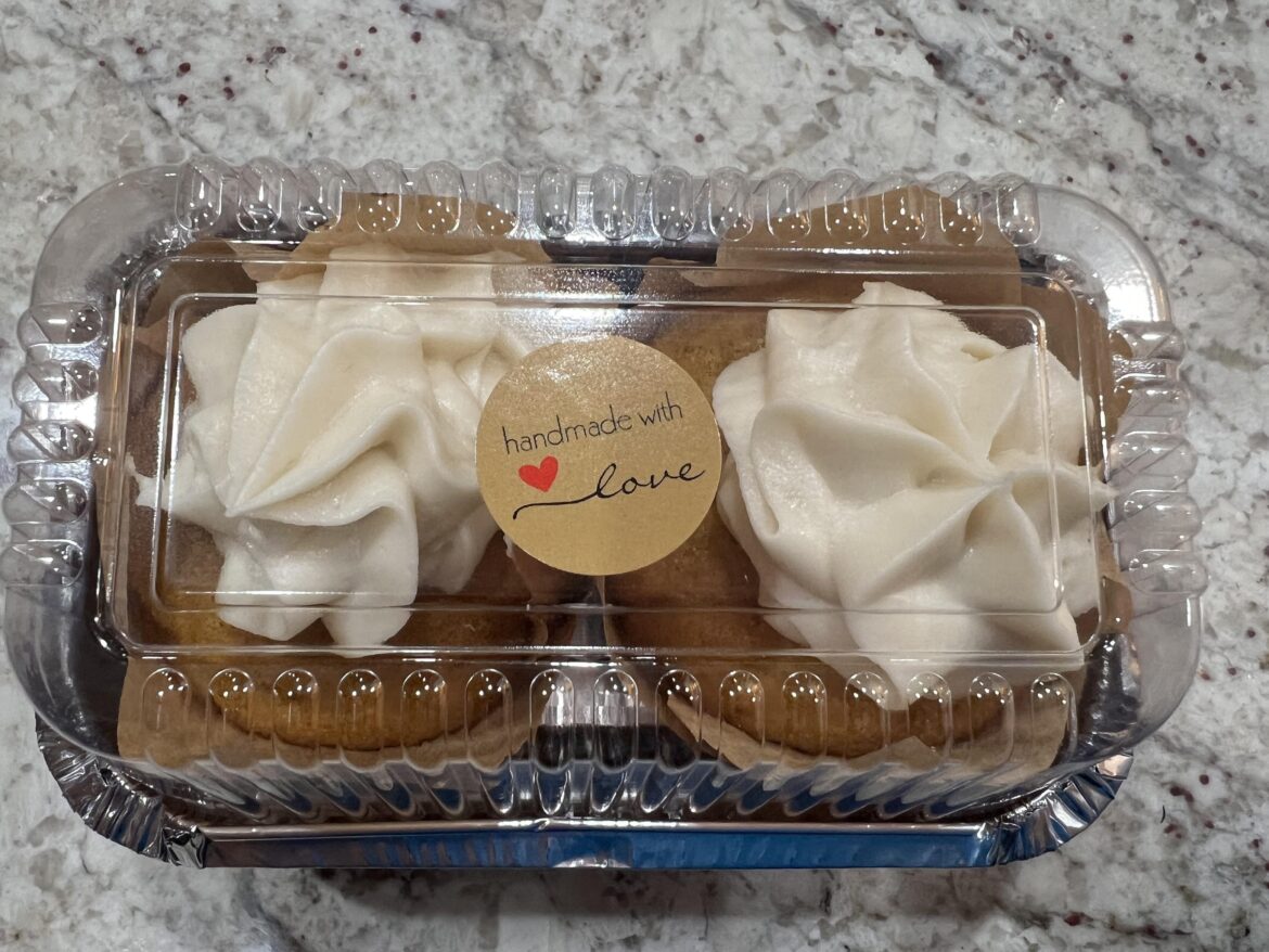 Cream cheese frosting filled pumpkin spice muffins